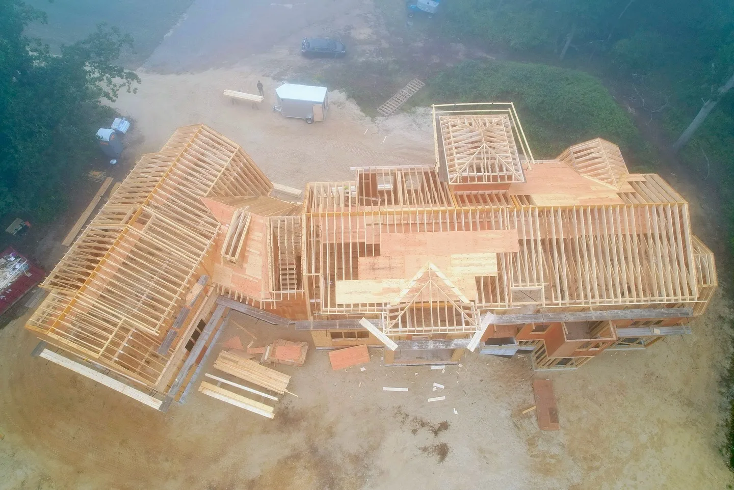 Top view of wood framing for a residential home, focusing on the roof structure.